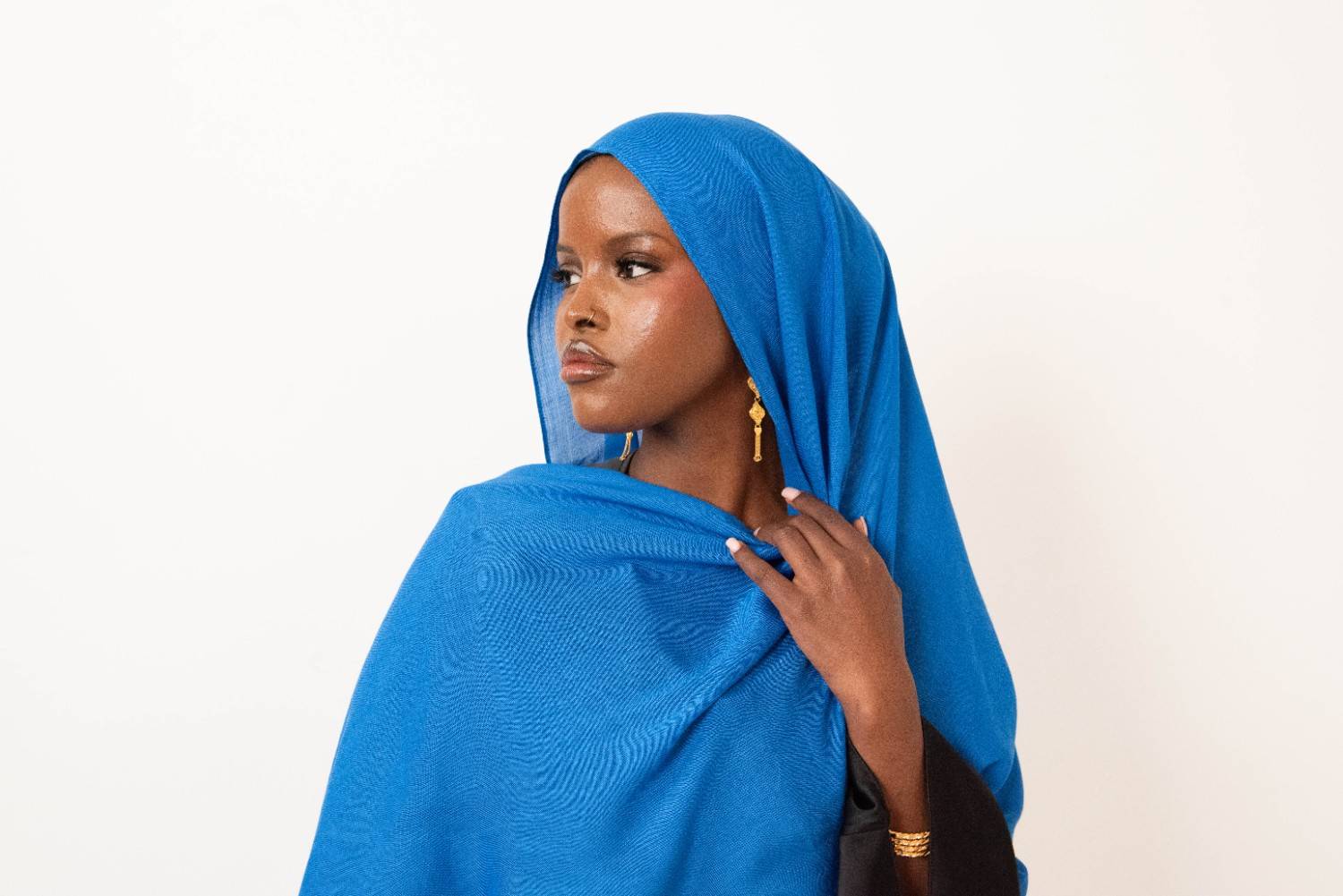 Royal blue modal hijab with matching jersey undercap - soft lightweight 100% modal fabric UK
Woman wearing royal blue hijab draped elegantly - modest fashion style UK
Royal blue modal scarf 180x100cm - breathable high-quality hijab with undercap
Close-up royal blue modal hijab fabric texture - luxurious soft drape
Royal blue hijab set - modal scarf and matching cotton jersey undercap UK