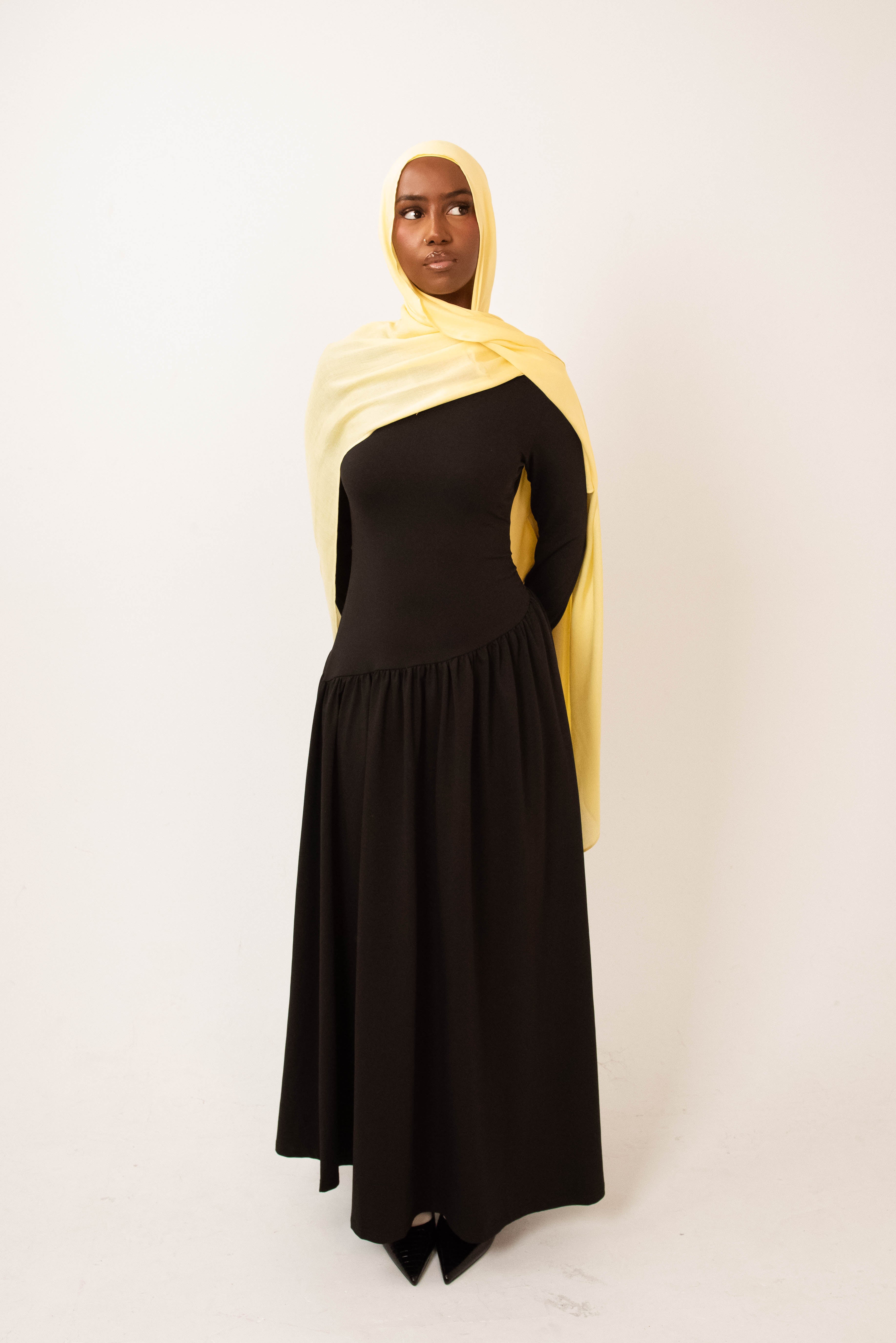 Butter yellow modal hijab with matching jersey undercap - soft lightweight 100% modal fabric UK
Woman wearing butter yellow hijab draped elegantly - modest fashion style UK
Butter yellow modal scarf 180x100cm - breathable high-quality hijab with undercap
Close-up butter yellow modal hijab fabric texture - luxurious soft drape
Butter yellow hijab set - modal scarf and matching cotton jersey undercap UK Butter yellow modal hijab styled for cheerful looks - sunny modest outfit inspiration
Bright butter yellow 