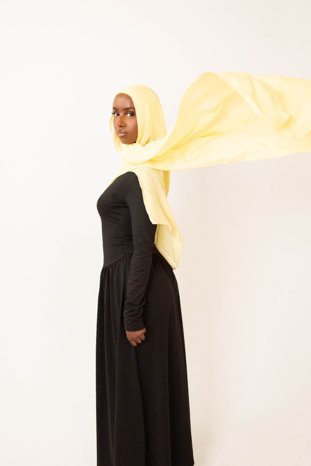 Butter yellow modal hijab with matching jersey undercap - soft lightweight 100% modal fabric UK
Woman wearing butter yellow hijab draped elegantly - modest fashion style UK
Butter yellow modal scarf 180x100cm - breathable high-quality hijab with undercap
Close-up butter yellow modal hijab fabric texture - luxurious soft drape
Butter yellow hijab set - modal scarf and matching cotton jersey undercap UK Butter yellow modal hijab styled for cheerful looks - sunny modest outfit inspiration
Bright butter yellow 